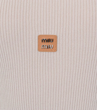 Logo of Beige knitted top with logo - CALIENTE