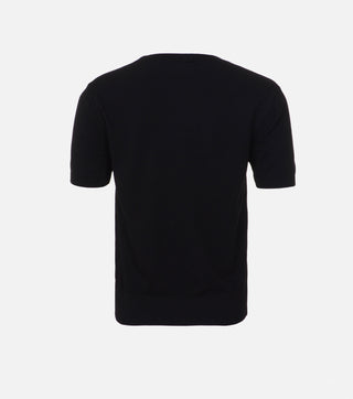 Back of black knitted blouse with anagram - CALIENTE