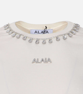 Close-up of Cream blouse with decorated collar - CALIENTE