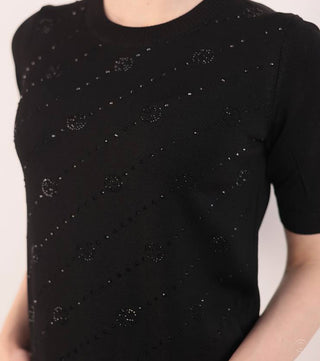 Close-up of model wear Black knitted blouse with crystals - CALIENTE