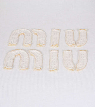 Detail of White embroidered t-shirt - CALIENTE