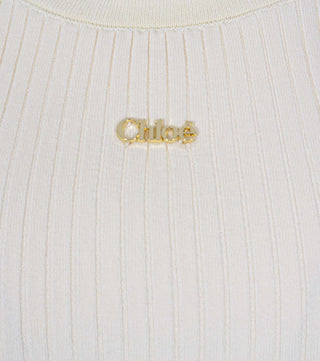 Close-up of Cream knitted top with logo - CALIENTE
