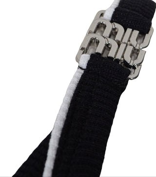 Details from Black ribbed cotton top with white details - CALIENTE