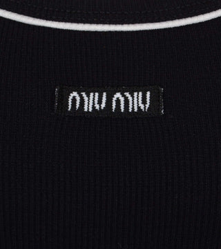 Close-up from Black ribbed cotton top with white details - CALIENTE